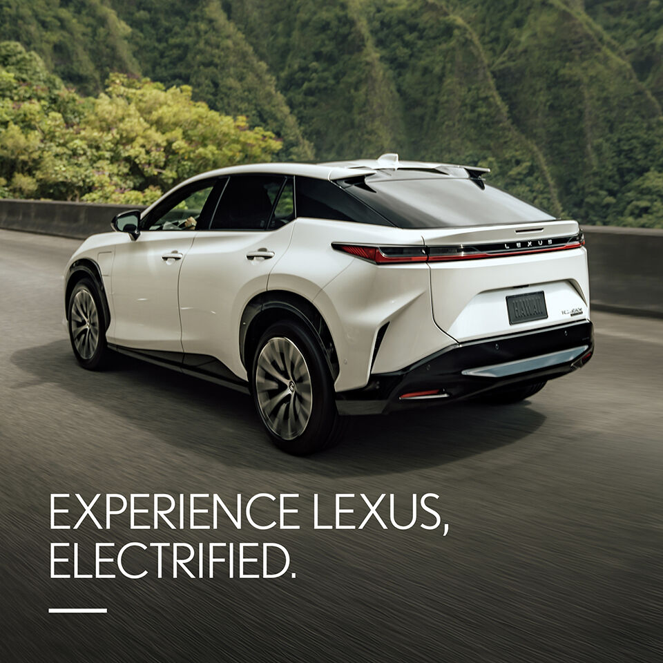 2024 RZ driving on road. Experience Lexus, Electrified.